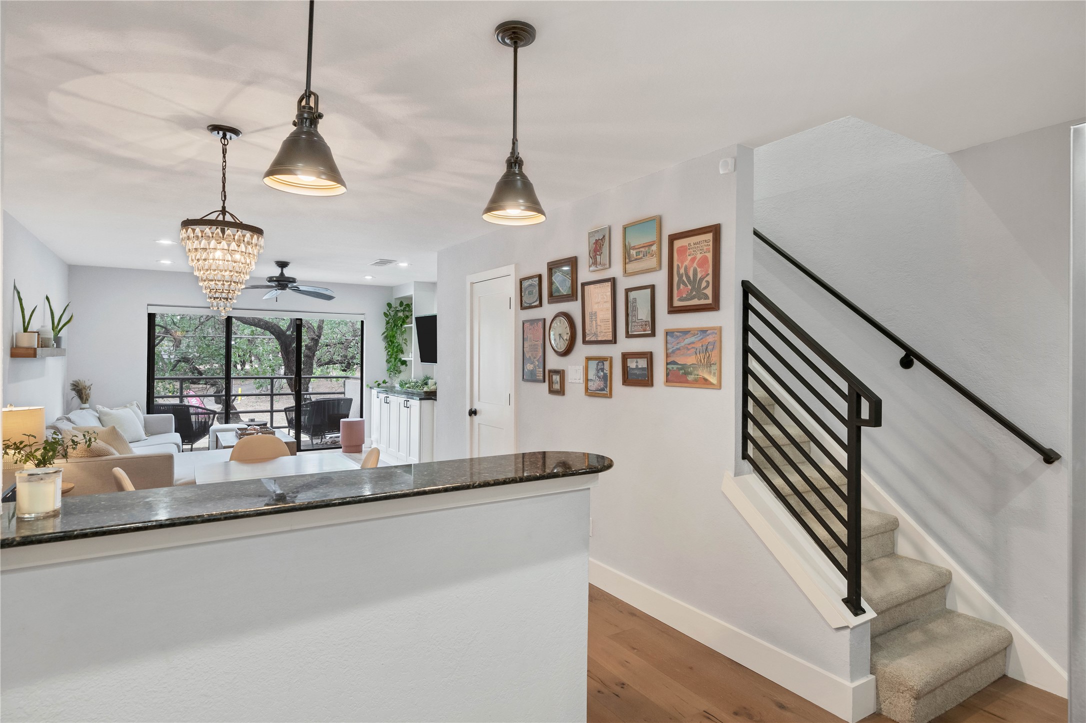 2605 Enfield Road, Unit 221 Austin, TX 78703 - Photo 30 of 30 Open floor plan offers a view from the kitchen to the living room. Note the modern stair railing.