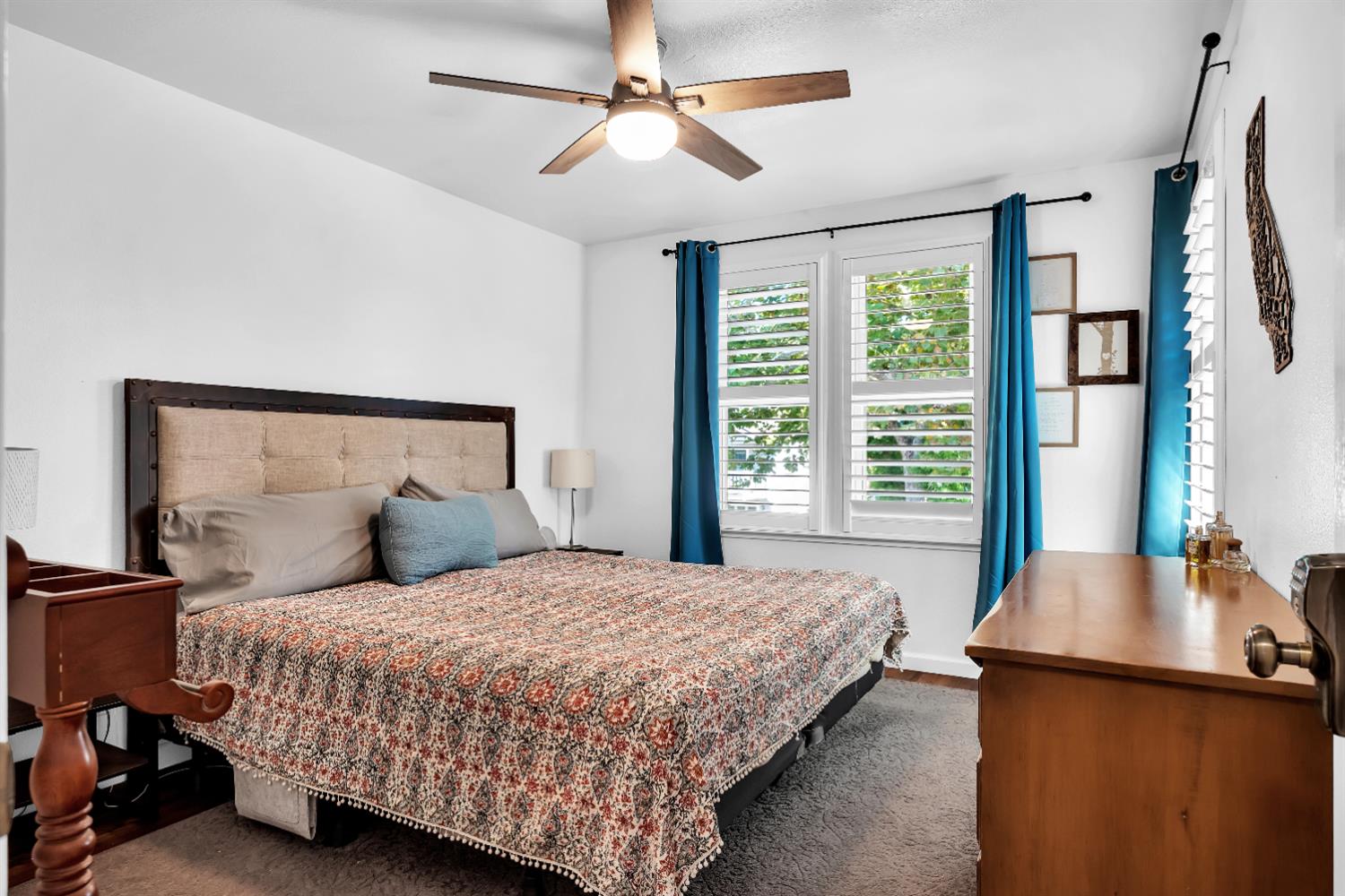 2008 5th Street, Unit 15 Sacramento, CA 95811 - Photo 11 of 49 a bedroom with a large bed and a chandelier