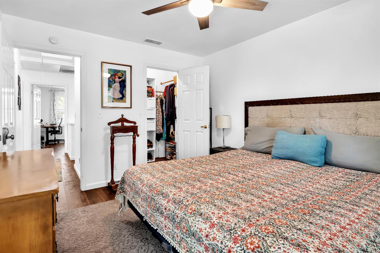 2008 5th Street, Unit 15 Sacramento, CA 95811 - Photo 12 of 49 a bedroom with a large bed and a chandelier