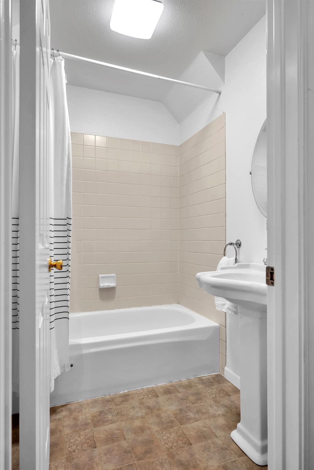 2008 5th Street, Unit 15 Sacramento, CA 95811 - Photo 21 of 49 a bathroom with a sink and a bathtub