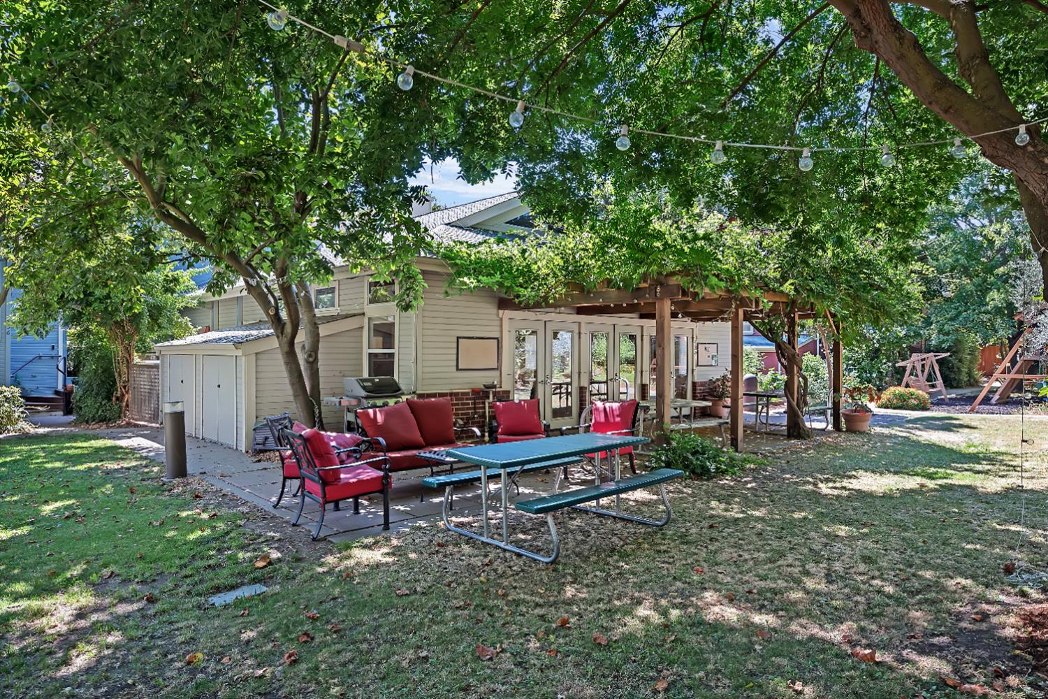 2008 5th Street, Unit 15 Sacramento, CA 95811 - Photo 26 of 49 a backyard of a house with fire pit and outdoor seating