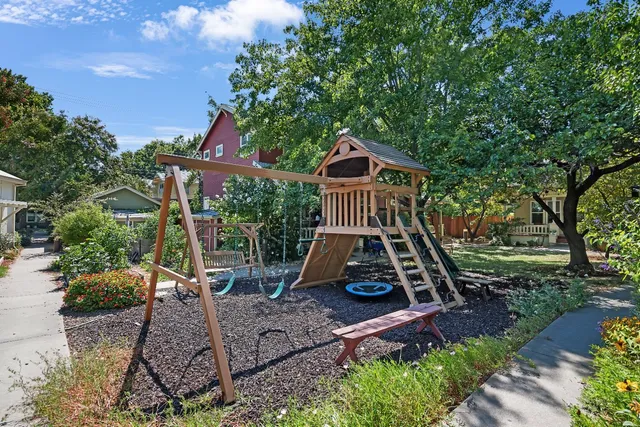 an aerial view of a house with a yard and garden