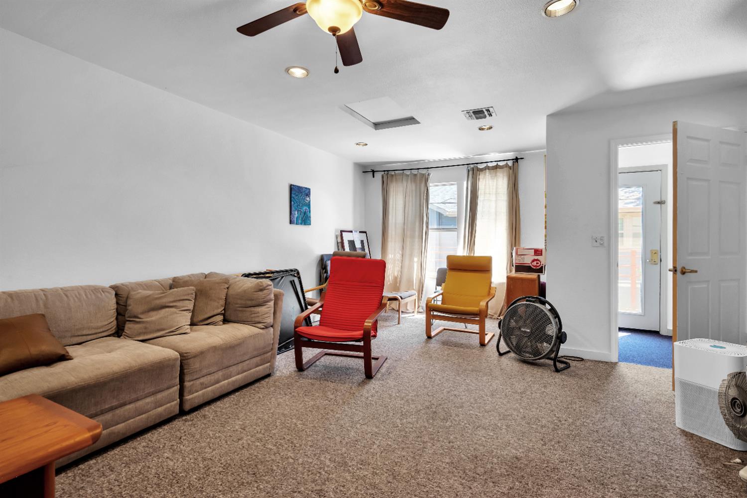 2008 5th Street, Unit 15 Sacramento, CA 95811 - Photo 39 of 49 a living room with furniture a couch and a chandelier