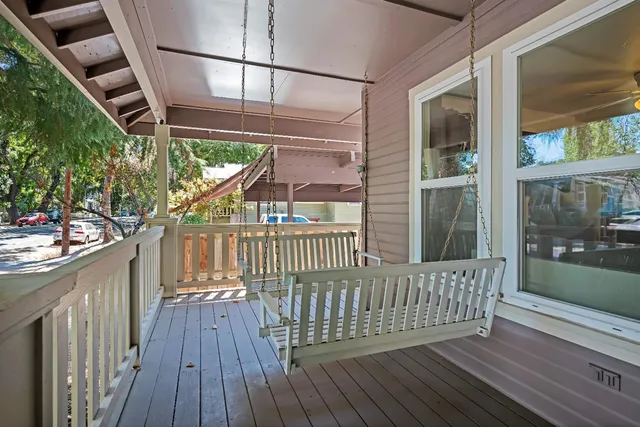 a view of balcony with wooden floor