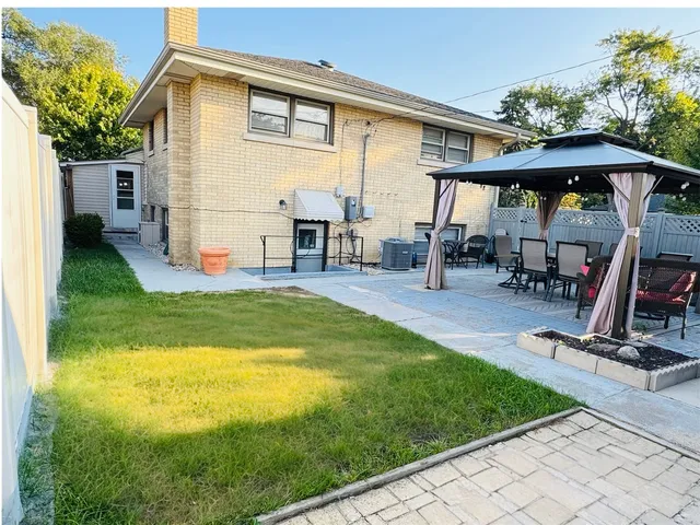 a view of a backyard with a patio