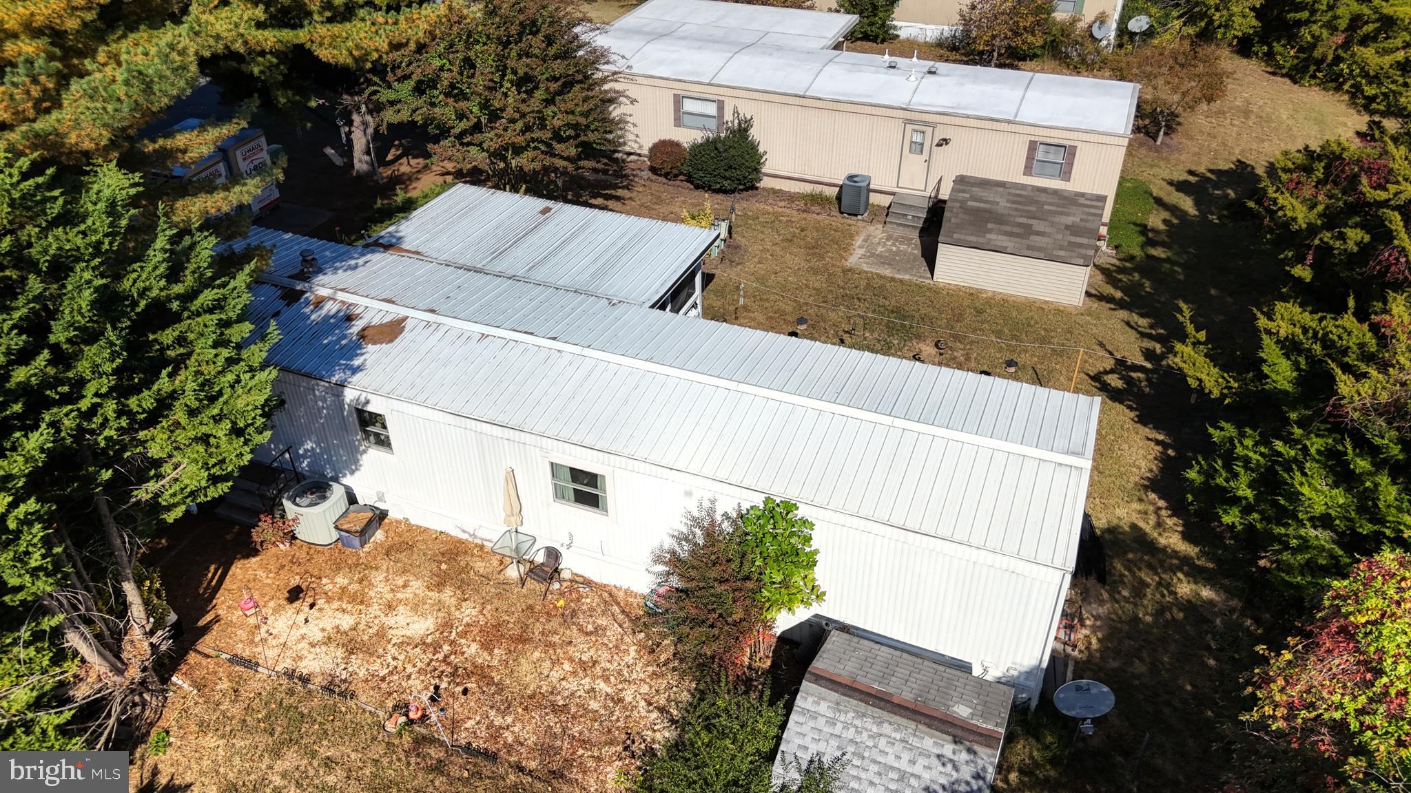 17261 Ridge Line Drive, Unit 18007 Lewes, DE 19958 - Photo 11 of 38 an aerial view of multiple houses with yard