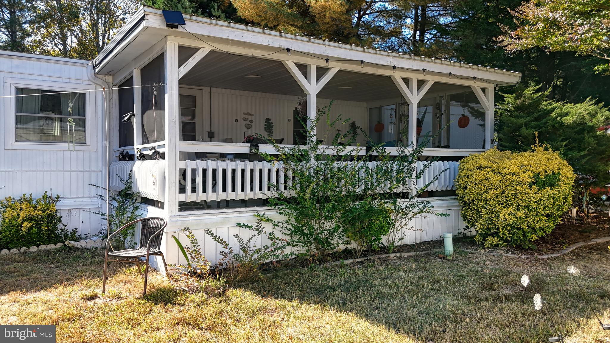 17261 Ridge Line Drive, Unit 18007 Lewes, DE 19958 - Photo 13 of 38 a front view of a house with garden