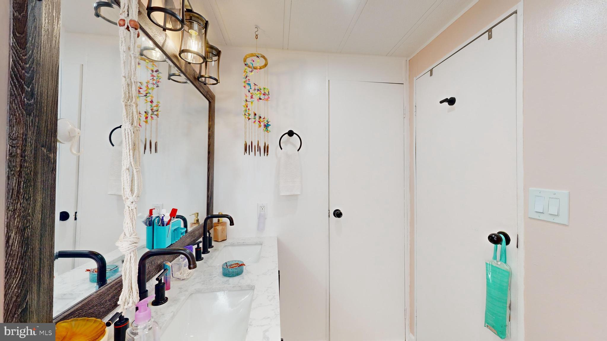 17261 Ridge Line Drive, Unit 18007 Lewes, DE 19958 - Photo 32 of 38 a bathroom with a bathtub and a shower