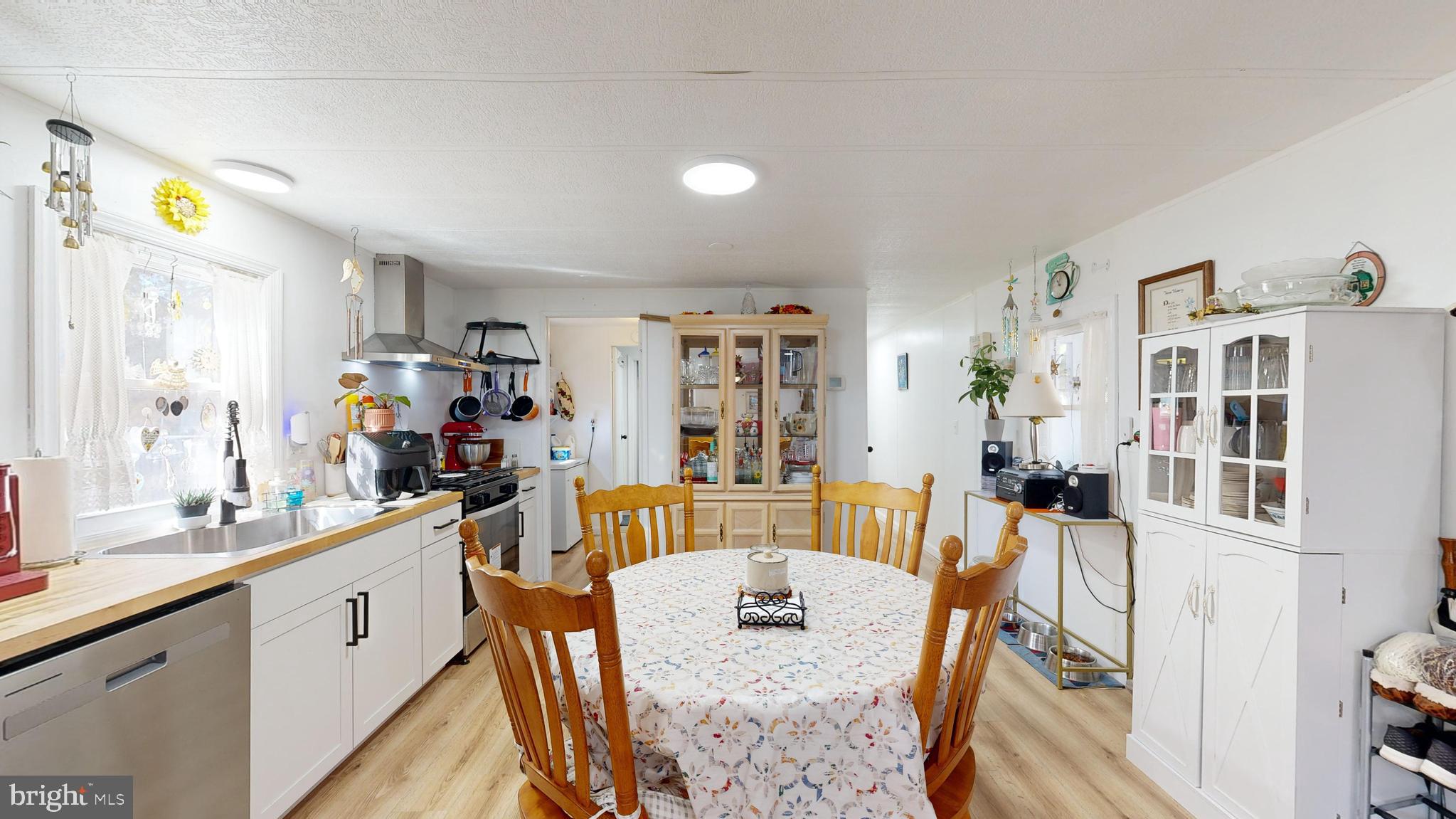 17261 Ridge Line Drive, Unit 18007 Lewes, DE 19958 - Photo 4 of 38 a view of a kitchen and dining room