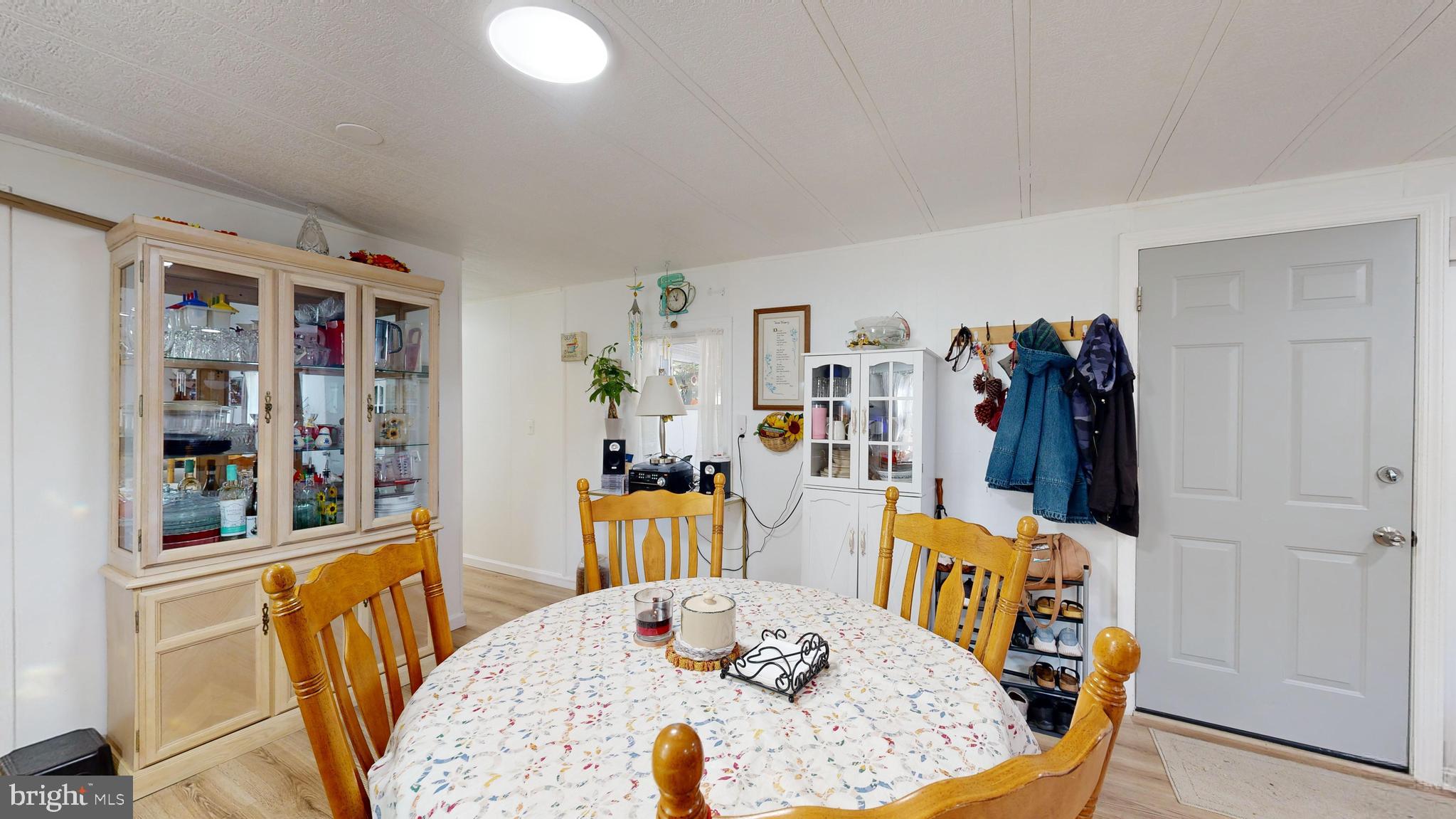 17261 Ridge Line Drive, Unit 18007 Lewes, DE 19958 - Photo 5 of 38 a view of a dining room with furniture