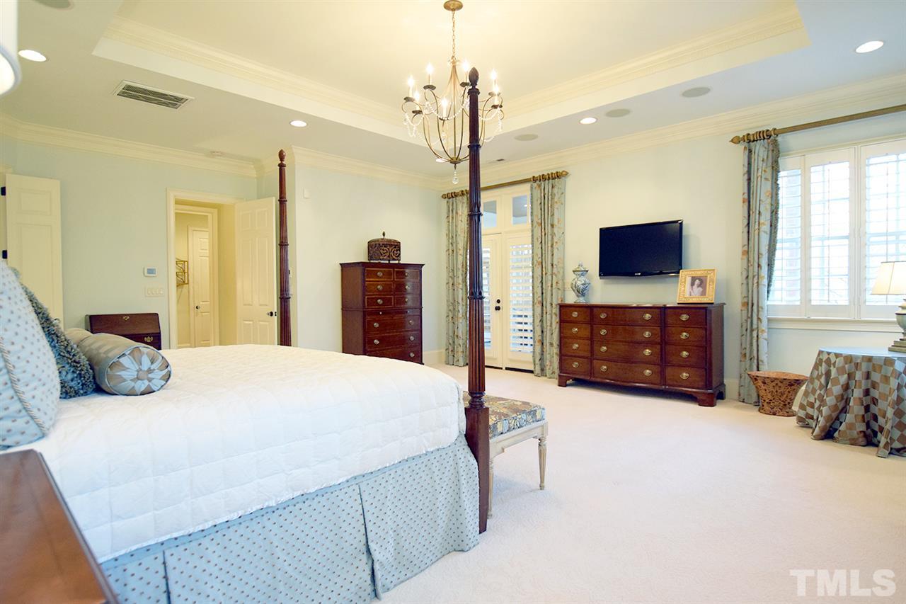 308 Marlowe Road Raleigh, NC 27609 - Photo 11 of 24 a bedroom with a bed and a television