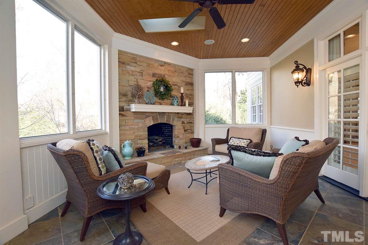 308 Marlowe Road Raleigh, NC 27609 - Photo 12 of 24 a living room with furniture a fireplace and a large window