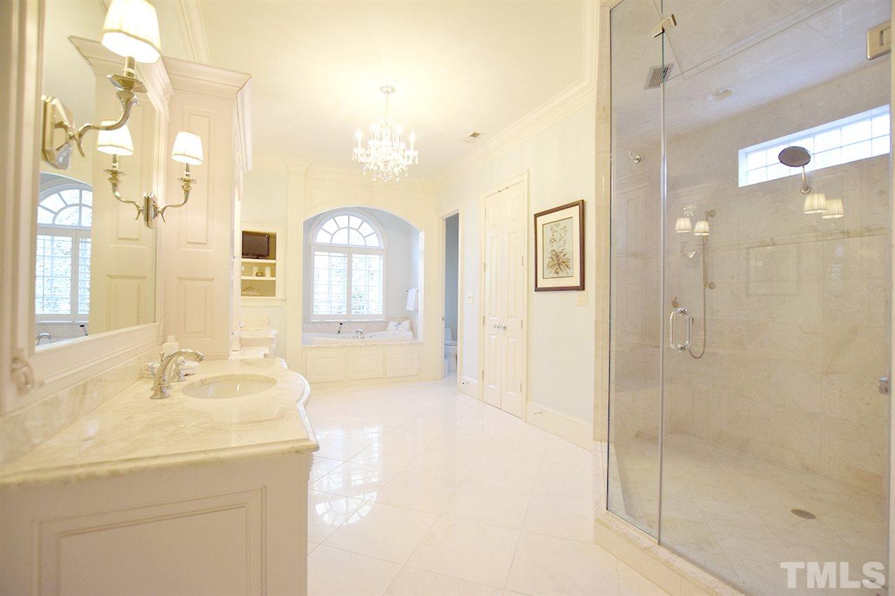 308 Marlowe Road Raleigh, NC 27609 - Photo 13 of 24 a bathroom with a granite countertop sink a shower and a mirror