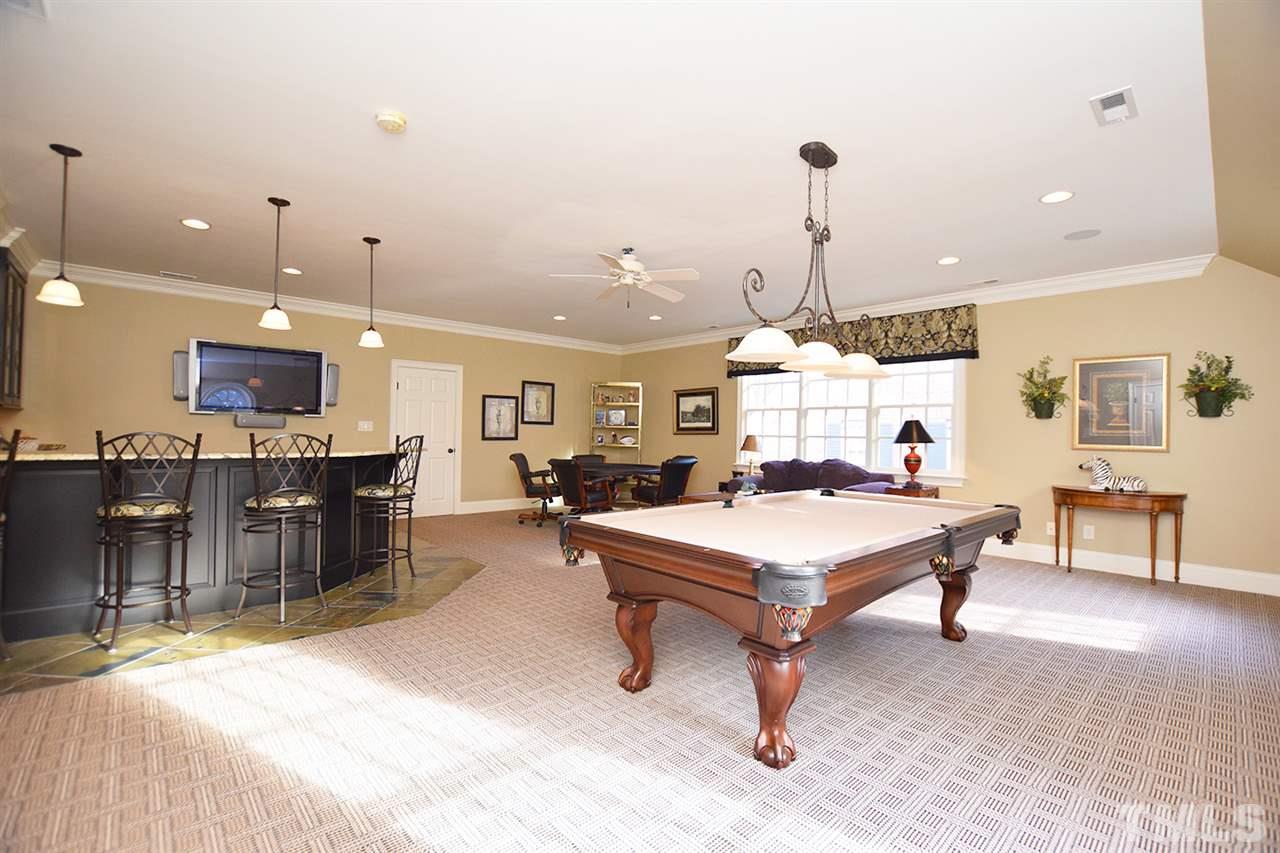308 Marlowe Road Raleigh, NC 27609 - Photo 16 of 24 a living room with furniture a rug and kitchen view