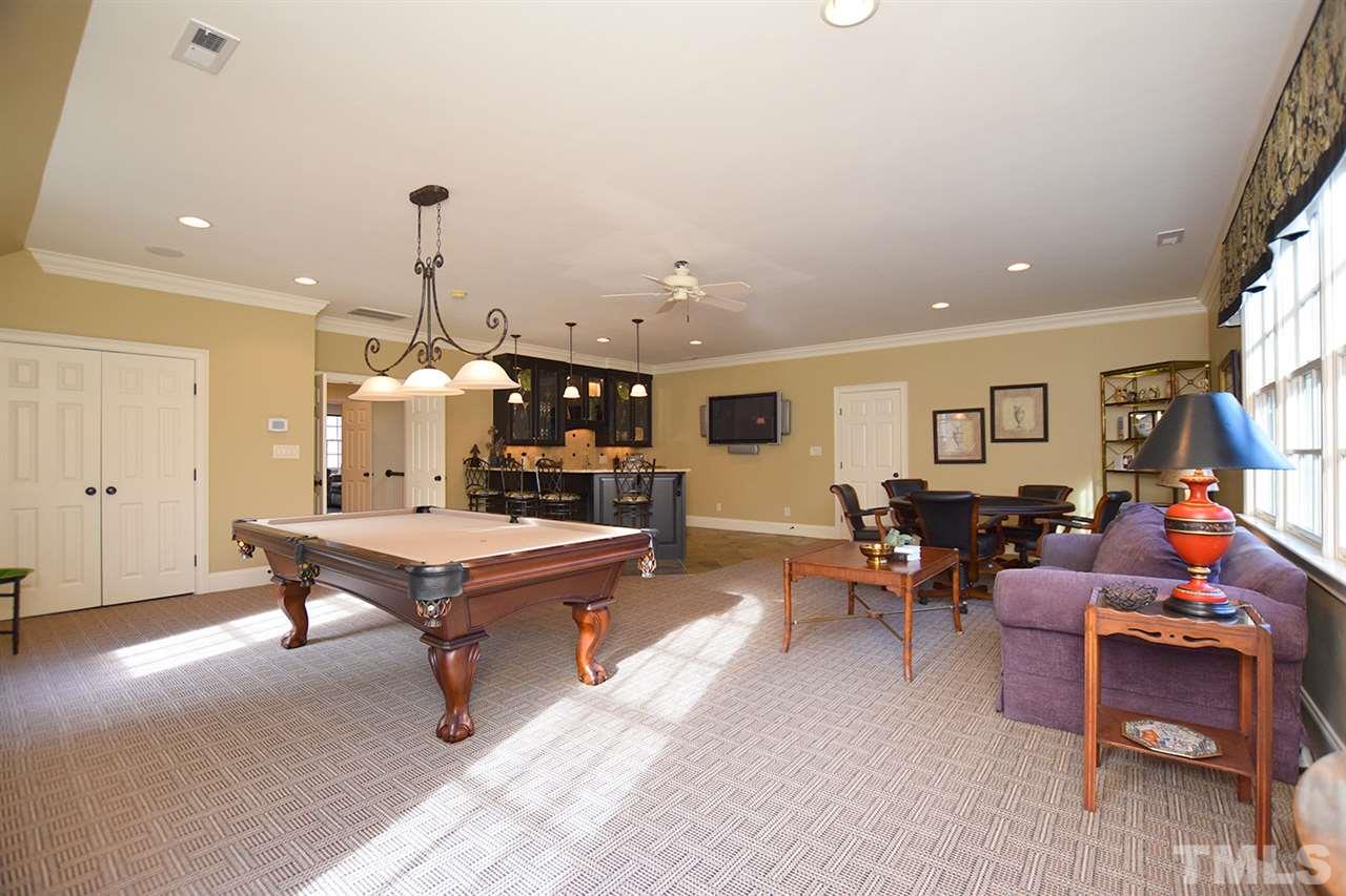308 Marlowe Road Raleigh, NC 27609 - Photo 17 of 24 a living room with furniture a rug and a flat screen tv