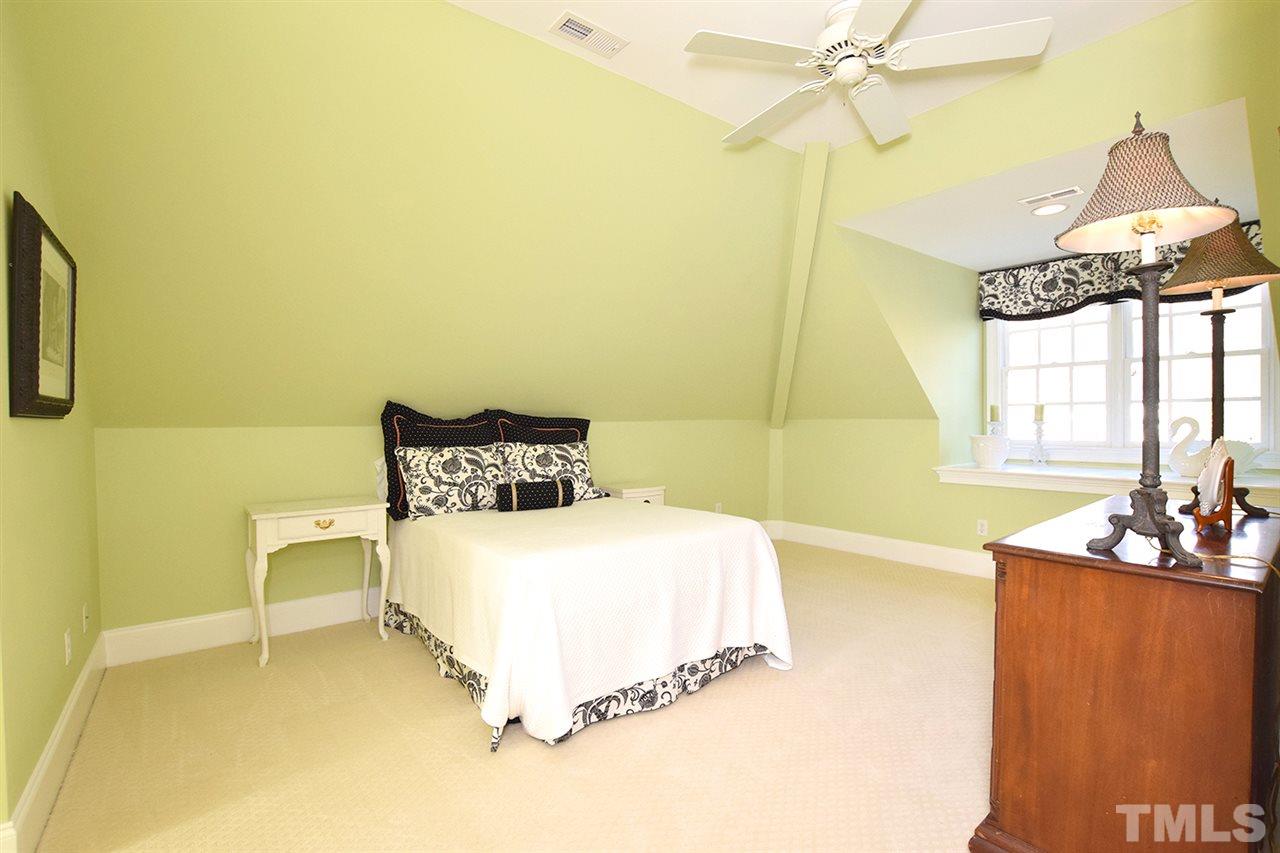 308 Marlowe Road Raleigh, NC 27609 - Photo 20 of 24 a bedroom with a bed window and table