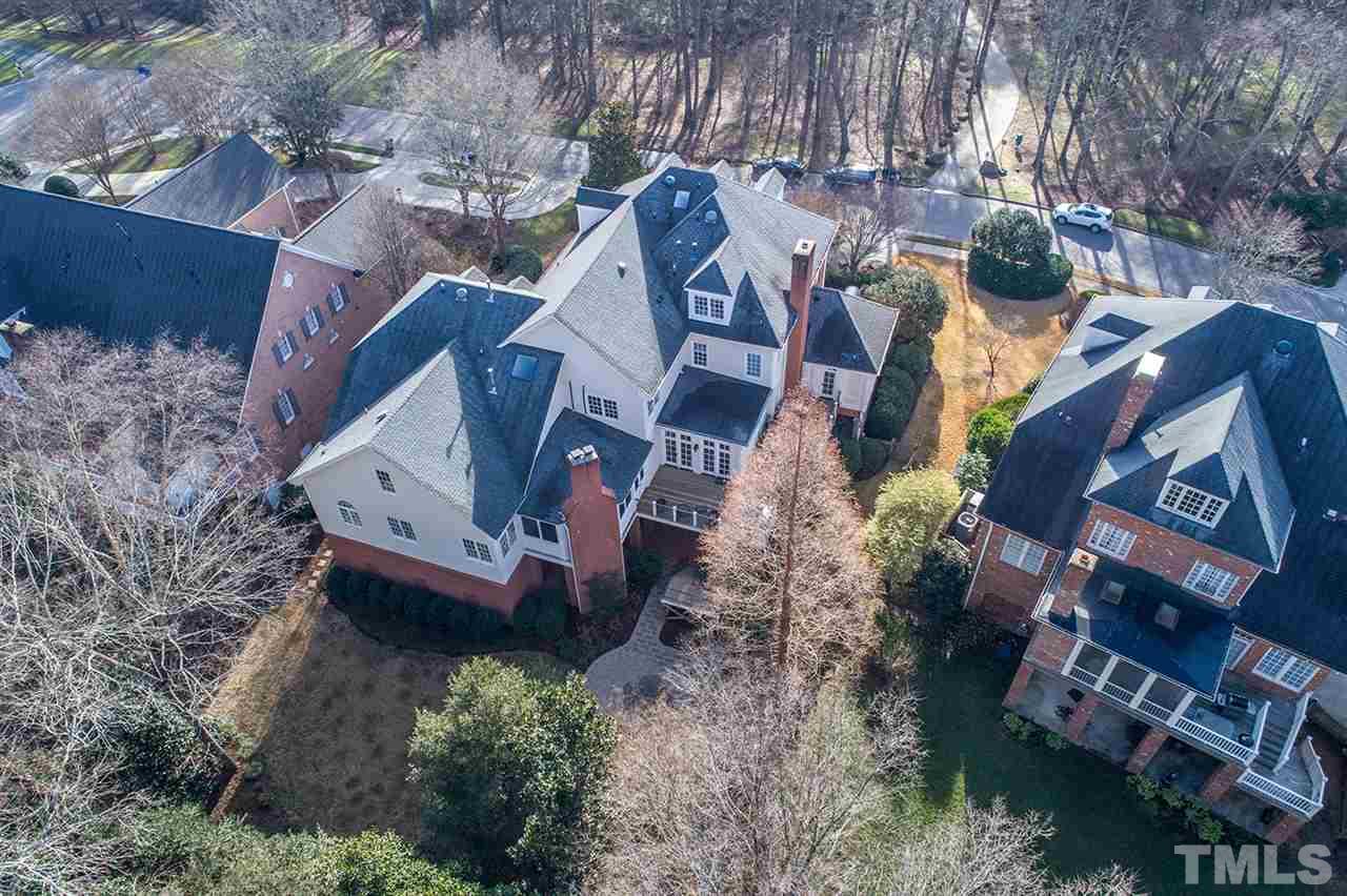 308 Marlowe Road Raleigh, NC 27609 - Photo 24 of 24 an aerial view of a house with a yard and lake view