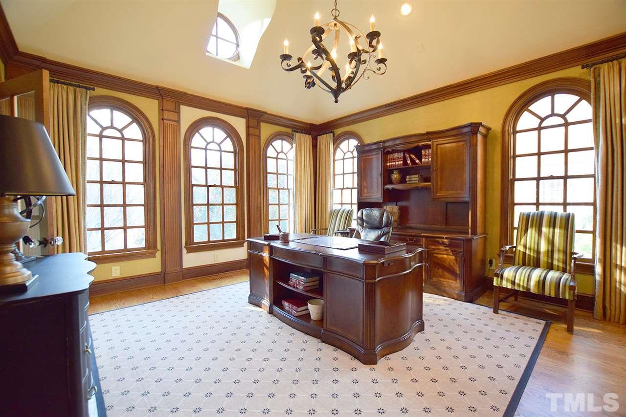 308 Marlowe Road Raleigh, NC 27609 - Photo 5 of 24 a view of a dining room with furniture a chandelier and wooden floor