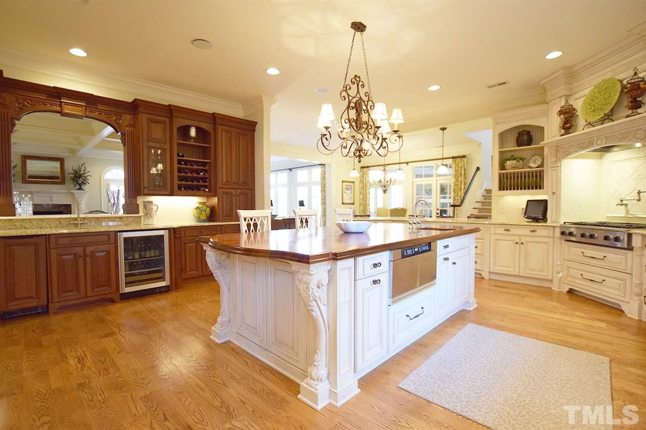 308 Marlowe Road Raleigh, NC 27609 - Photo 8 of 24 a kitchen with stainless steel appliances a sink and cabinets