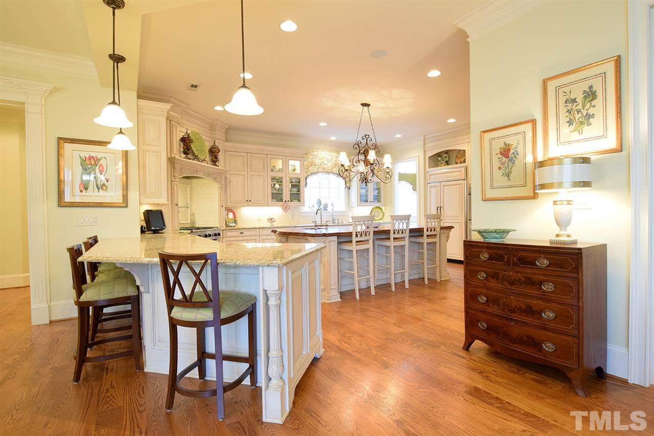308 Marlowe Road Raleigh, NC 27609 - Photo 9 of 24 a room with stainless steel appliances kitchen island granite countertop furniture and a view of living room