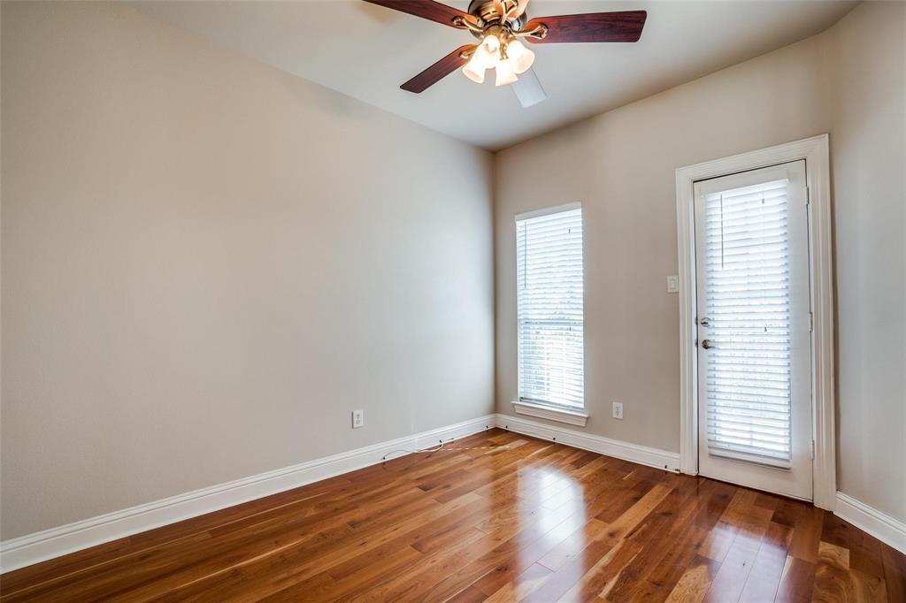 5827 Lewis Street Dallas, TX 75206 - Photo 11 of 24 an empty room with wooden floor and windows