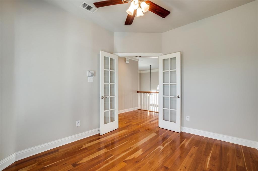 5827 Lewis Street Dallas, TX 75206 - Photo 12 of 24 a view of empty room with wooden floor
