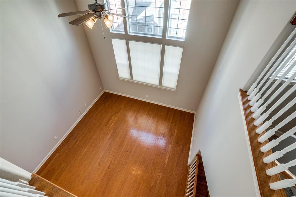 5827 Lewis Street Dallas, TX 75206 - Photo 17 of 24 a view of a room with wooden floor and windows