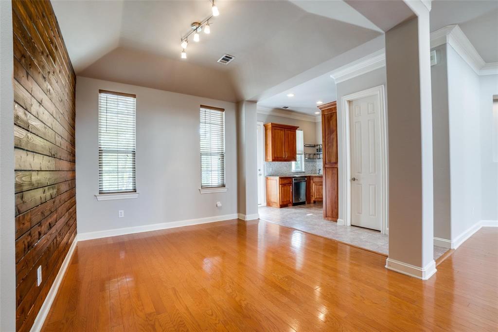 5827 Lewis Street Dallas, TX 75206 - Photo 20 of 24 a view of an empty room with a window and fireplace