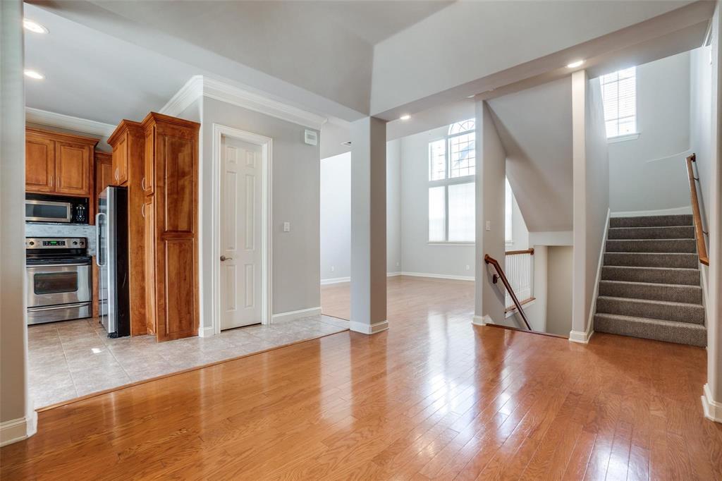 5827 Lewis Street Dallas, TX 75206 - Photo 2 of 24 a view of entryway with wooden floor and stairs