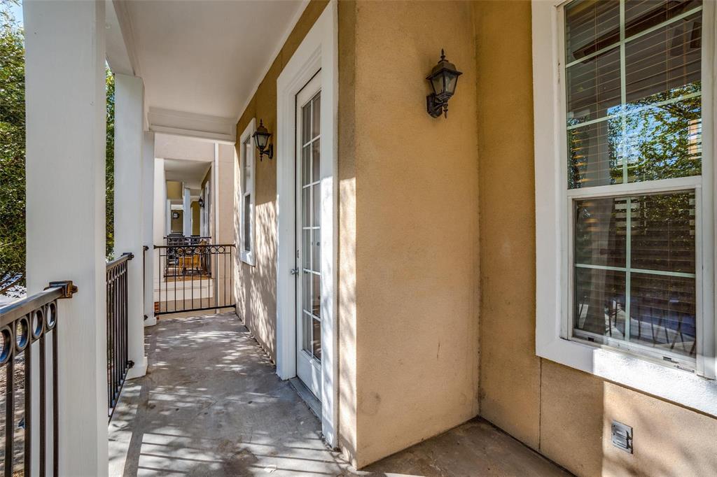 5827 Lewis Street Dallas, TX 75206 - Photo 22 of 24 a view of a porch with wooden floor and a gate