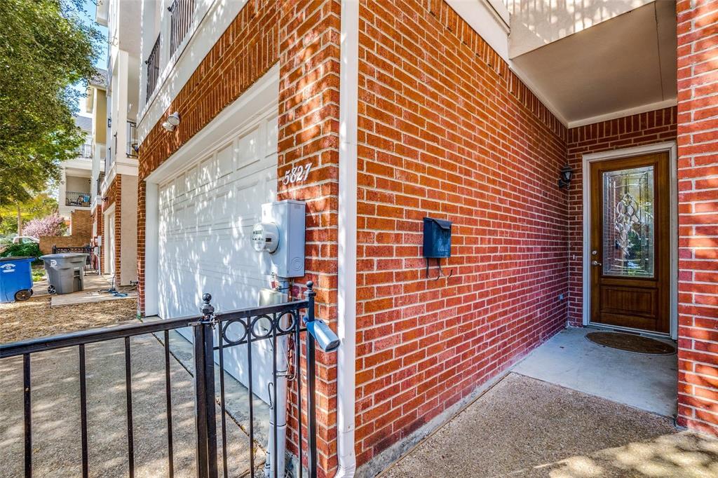 5827 Lewis Street Dallas, TX 75206 - Photo 23 of 24 a view of a brick house with stairs and wooden floor