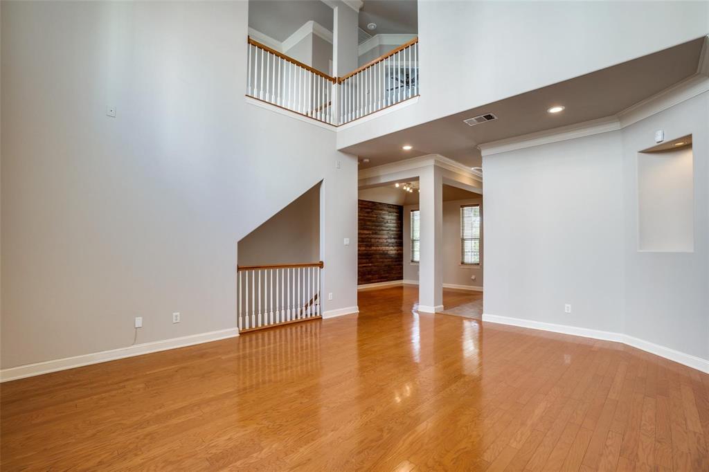 5827 Lewis Street Dallas, TX 75206 - Photo 6 of 24 a view of an empty room with wooden floor