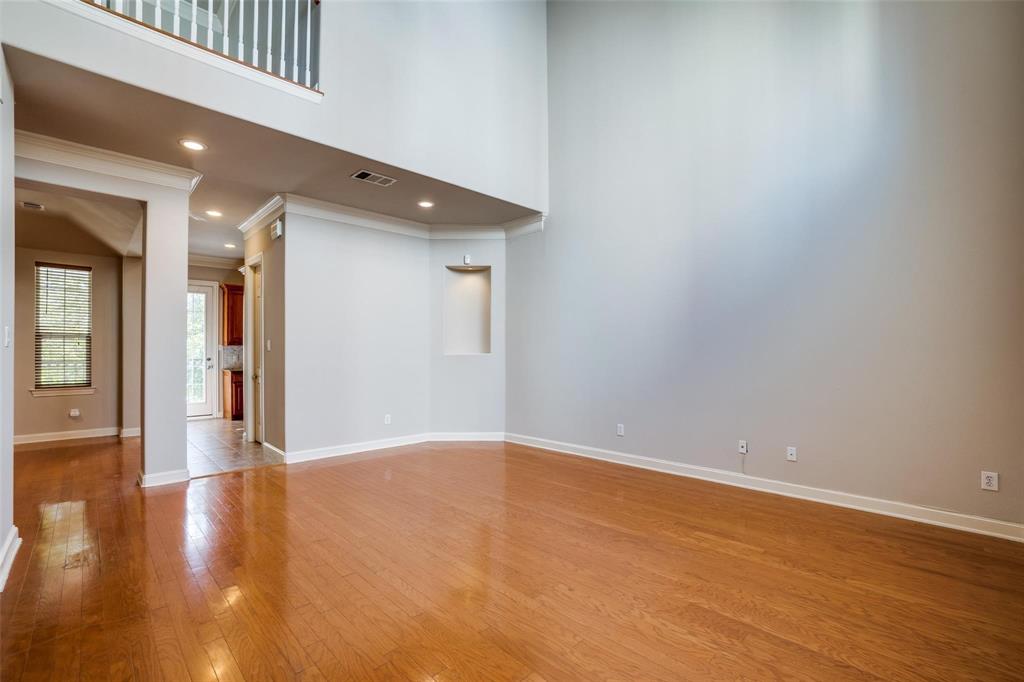 5827 Lewis Street Dallas, TX 75206 - Photo 8 of 24 a view of an empty room with wooden floor