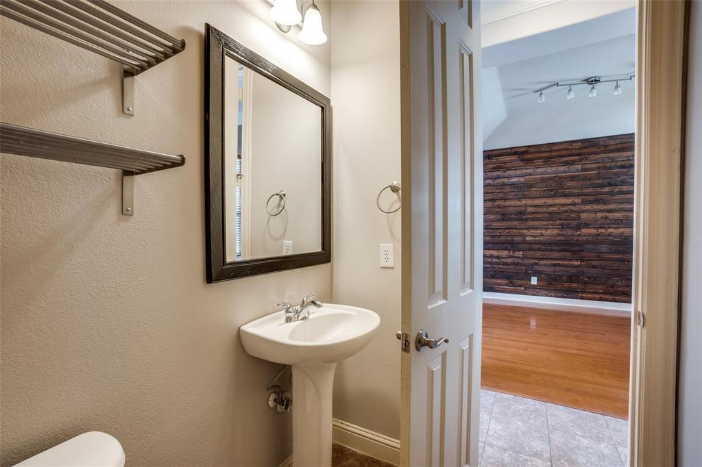 5827 Lewis Street Dallas, TX 75206 - Photo 10 of 24 a bathroom with a sink and mirror