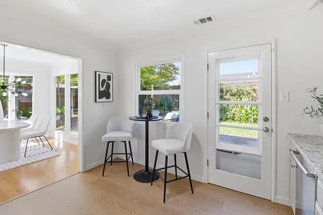 a view of a dining room with furniture window and outside view