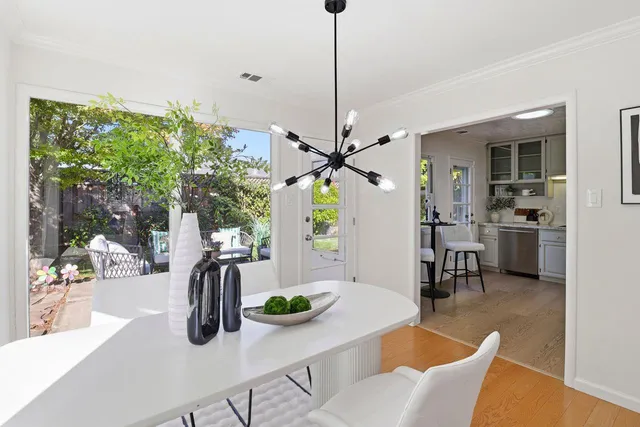 a view of a dining room with furniture window and outside view