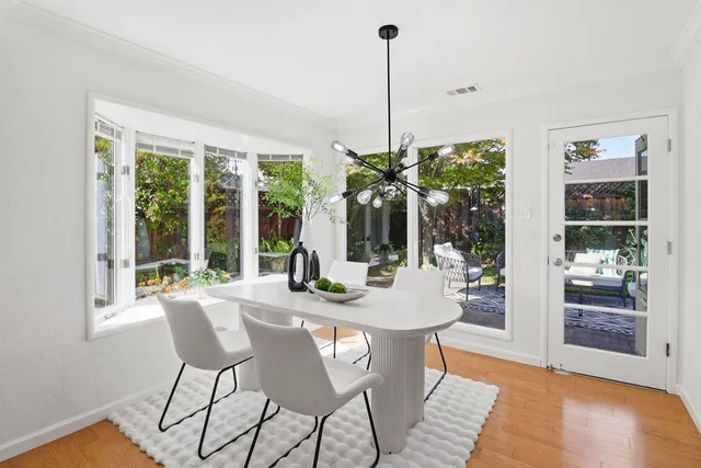 a bedroom with a bed and a night stand