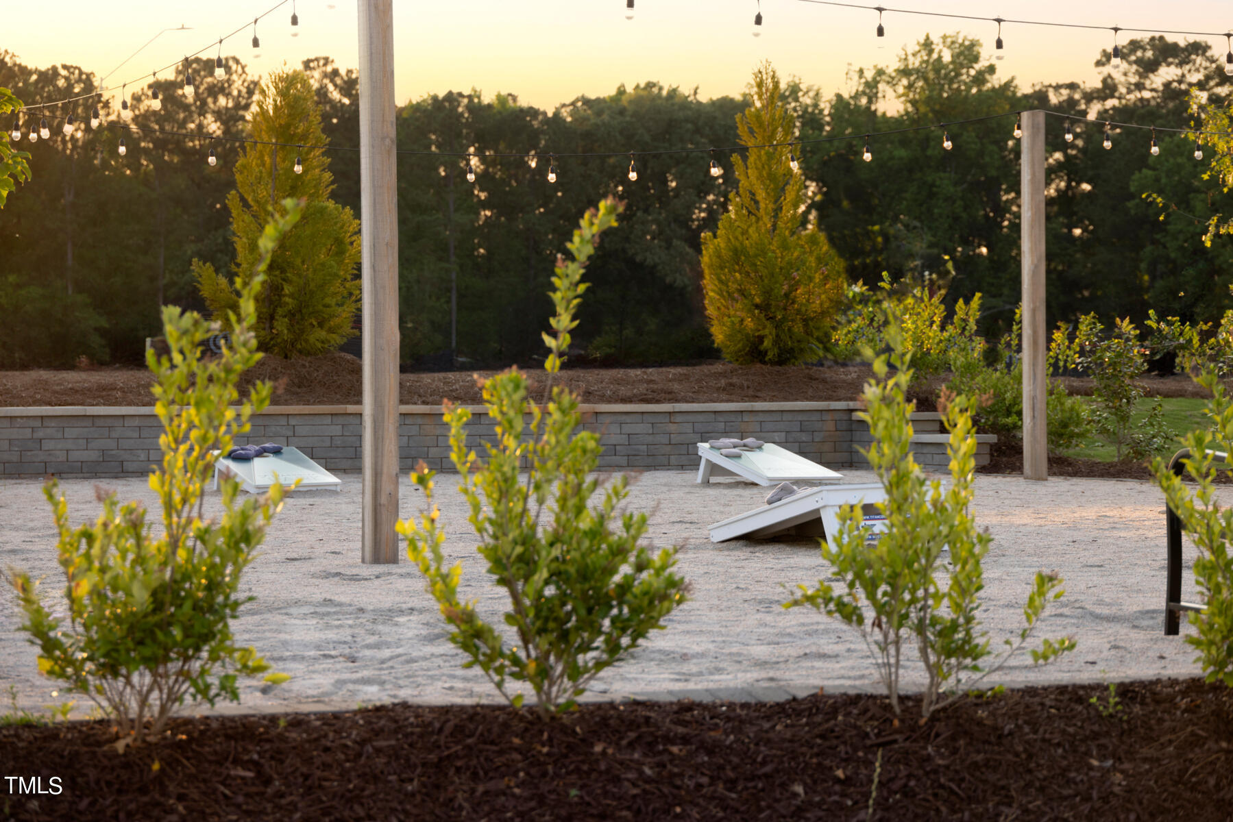 155 Siebold Street Garner, NC 27529 - Photo 48 of 70 a view of a pathway with flower garden