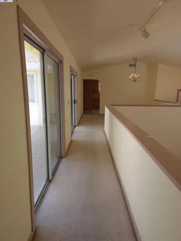 a view of a hallway with closet