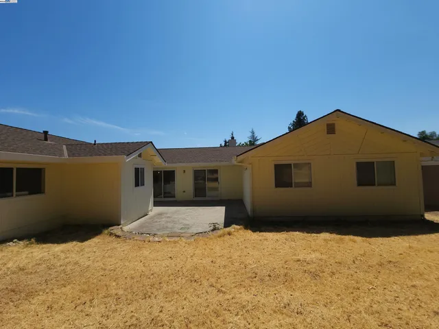a house covered with snow in front of it