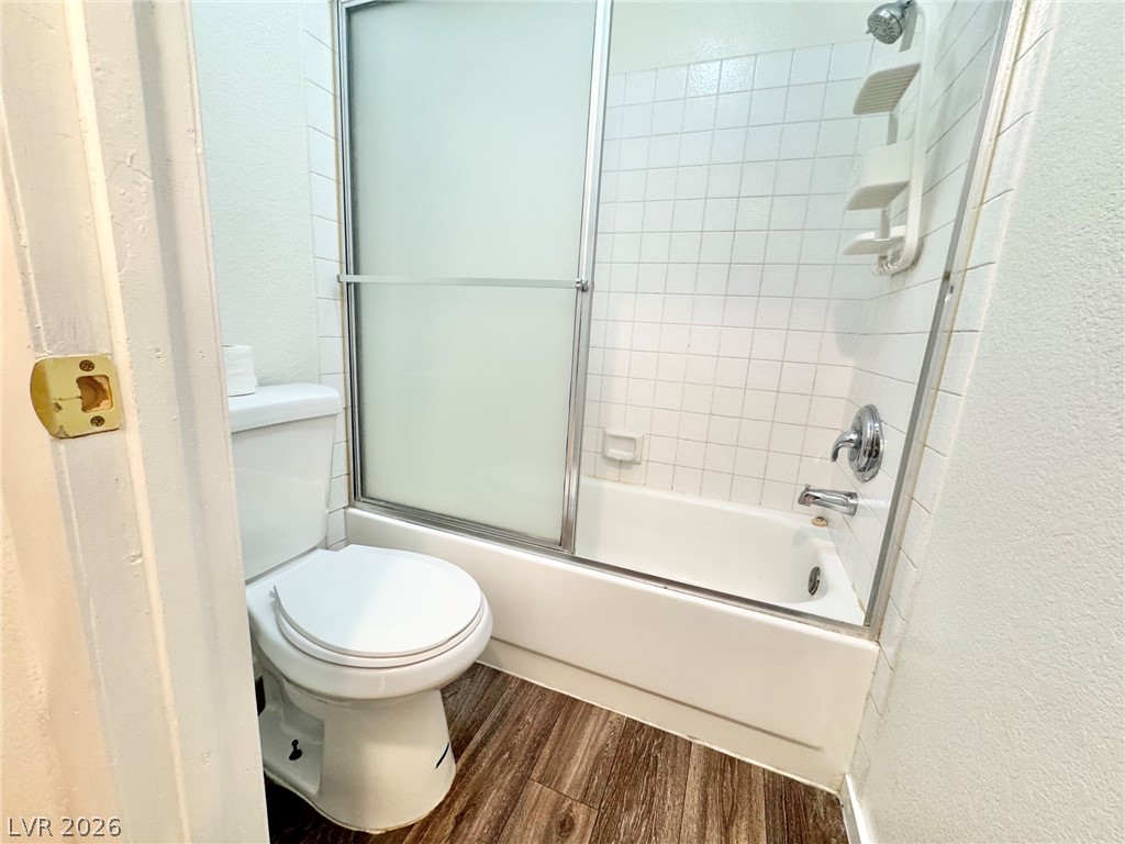 6250 West Flamingo Road, Unit 109 Las Vegas, NV 89103 - Photo 11 of 18 Functional full bathroom featuring a tub and shower combination with sliding glass doors.