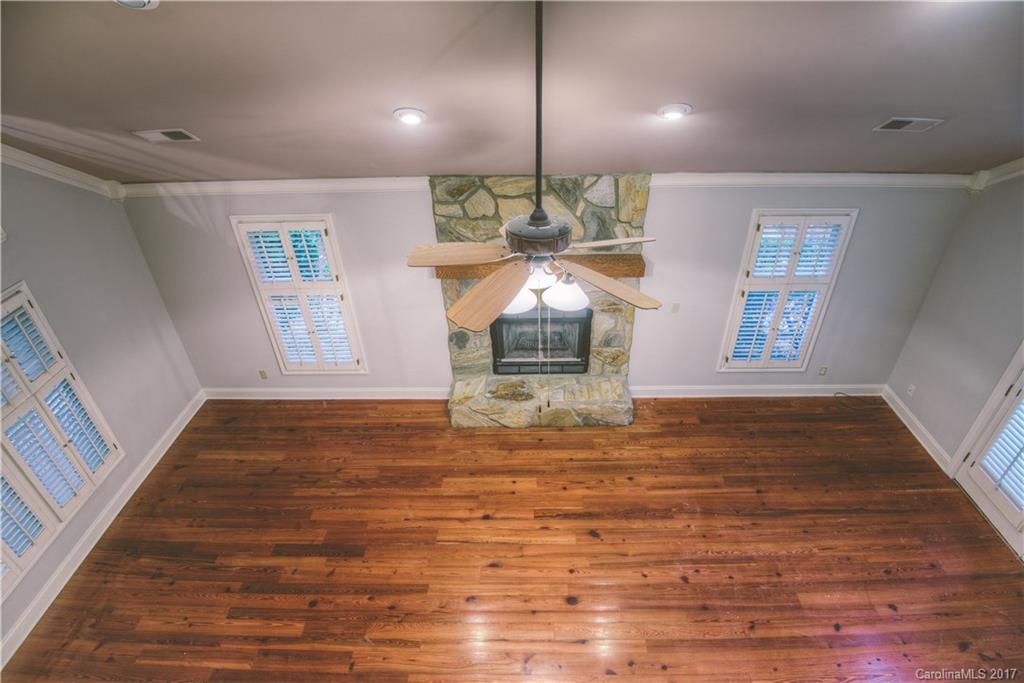 3091 Point Clear Drive Tega Cay, SC 29708 - Photo 12 of 23 a view of an empty room with wooden floor and a window