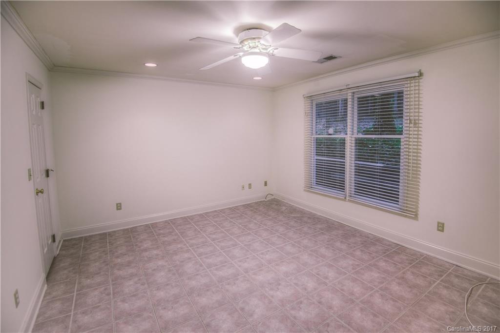 3091 Point Clear Drive Tega Cay, SC 29708 - Photo 14 of 23 a view of a livingroom with a ceiling fan and window