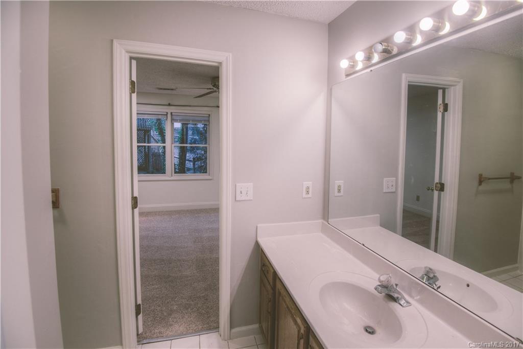 3091 Point Clear Drive Tega Cay, SC 29708 - Photo 17 of 23 a bathroom with a sink and a mirror