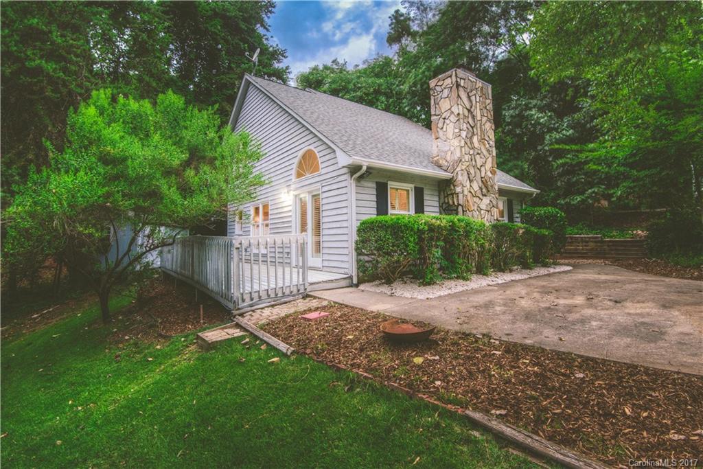 3091 Point Clear Drive Tega Cay, SC 29708 - Photo 22 of 23 a front view of a house with a garden