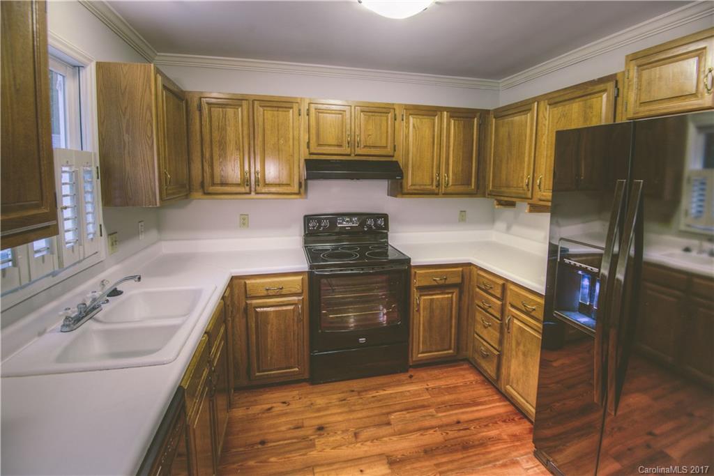 3091 Point Clear Drive Tega Cay, SC 29708 - Photo 6 of 23 a kitchen with a sink stove and refrigerator