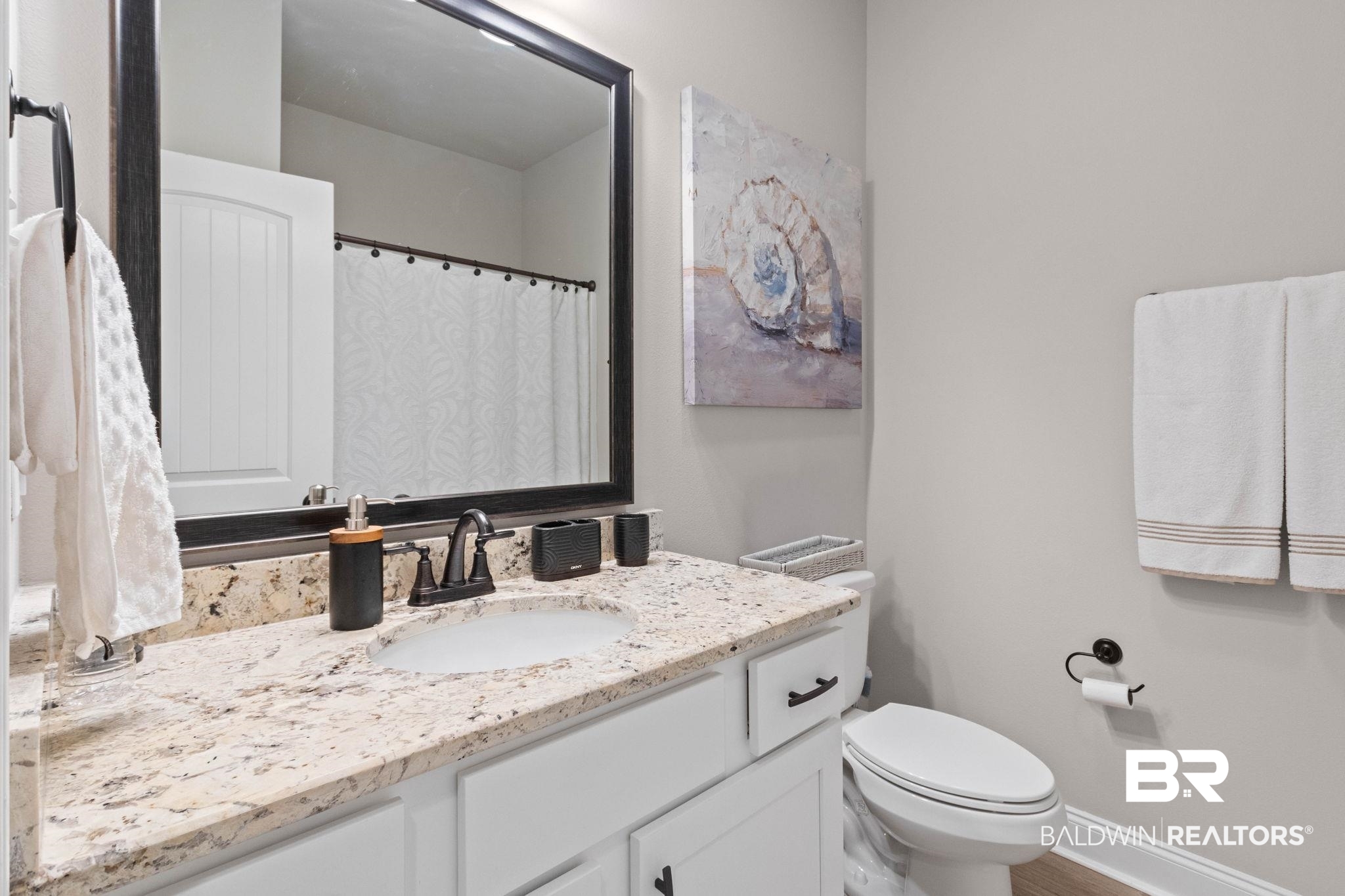 22244 Hibiscus Circle Foley, AL 36535 - Photo 37 of 51 Bathroom featuring a single vanity with stone-finish countertop, white cabinetry, undermount sink, and dark bronze-finish fixtures