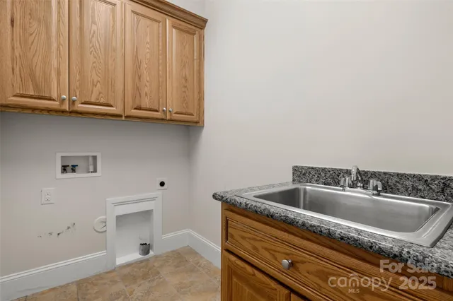 a bathroom with a sink and cabinets