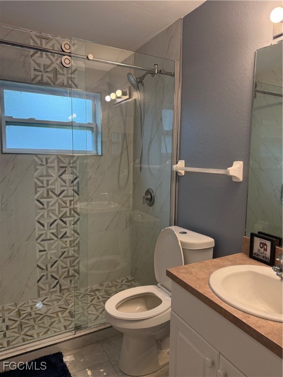 3509 8th Street Southwest Lehigh Acres, FL 33976 - Photo 7 of 14 a bathroom with a toilet sink and shower