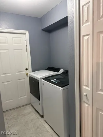 a spacious bathroom with a sink a large mirror and a shower